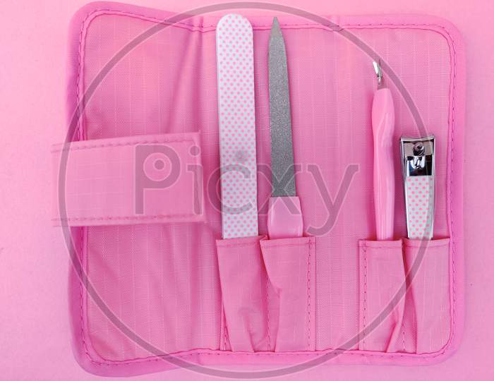 Set Of Pink Color Nail Clipper Or Manicure Tools In Pink Pouch.
