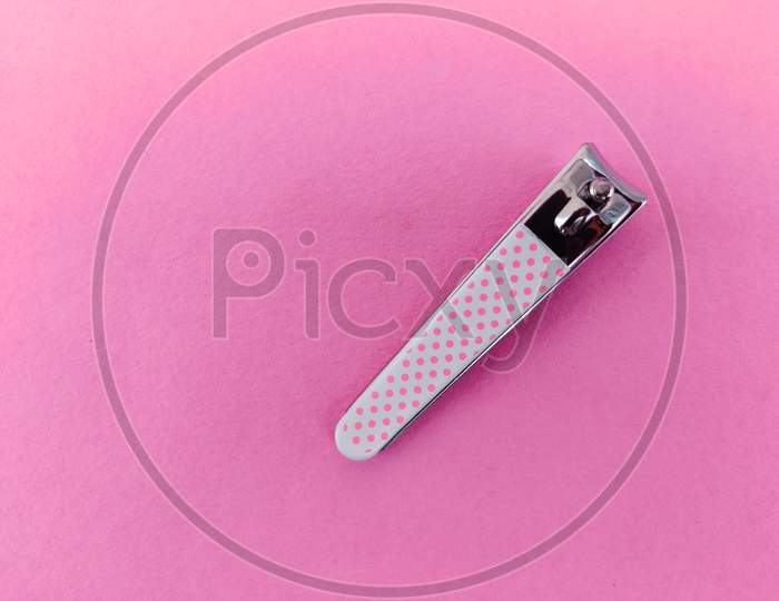 Pink Color Nail Clipper Or Nail Cutter Isolated On Pink Background