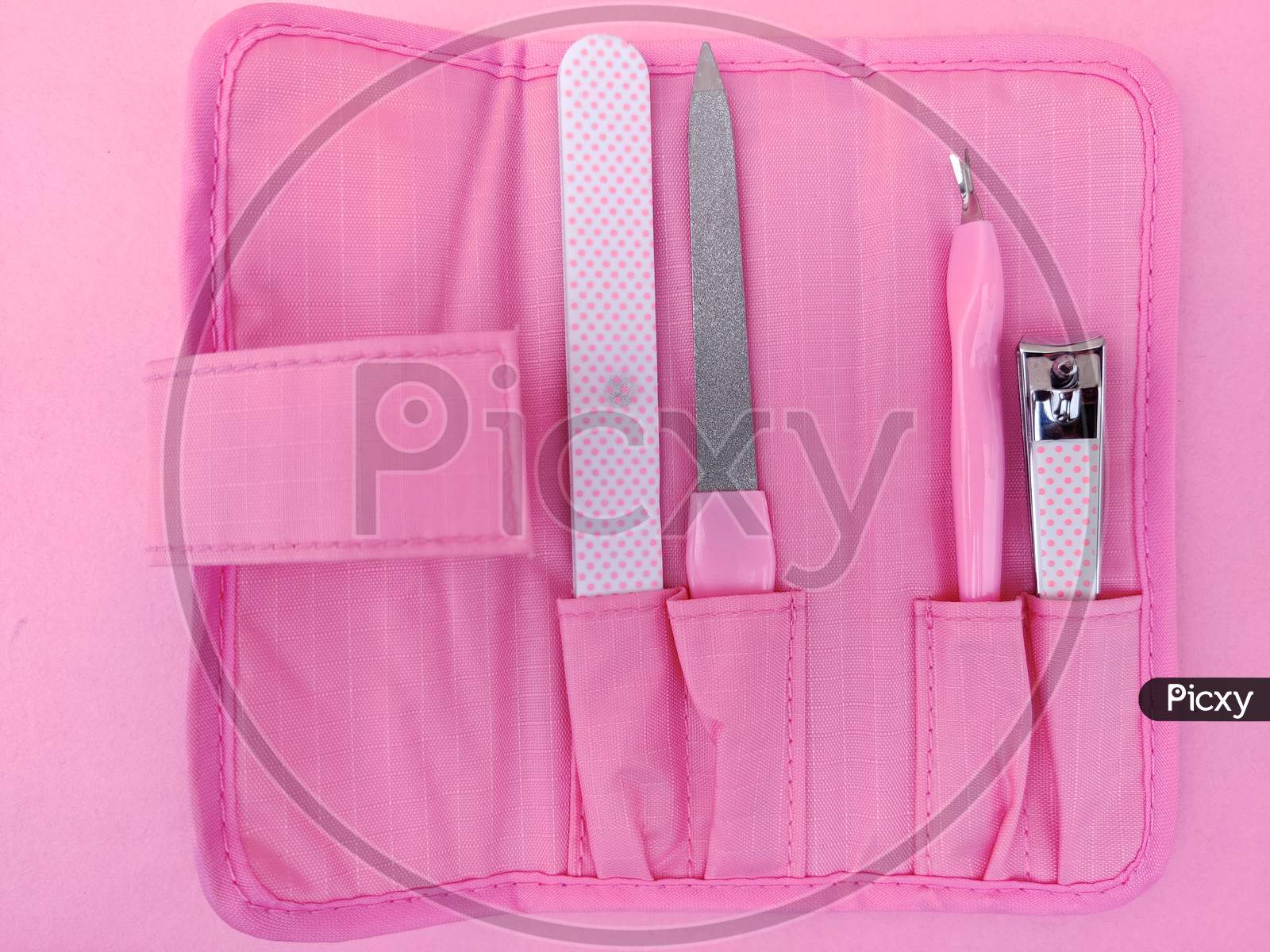 Set Of Pink Color Nail Clipper Or Manicure Tools In Pink Pouch.
