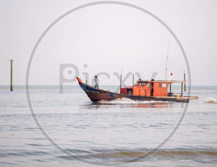 A Fisherman Stand In Front Of Boat Go Back Home