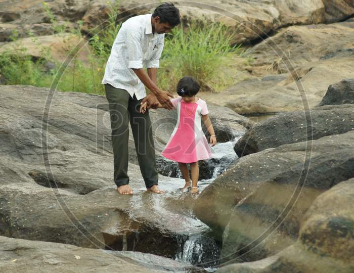 Thrissur, Kerala, India - 05-02-2016: A Girl Child With Her Father Playing In The River.