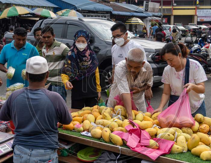 People Buy Fruit At Malaysia Morning Market