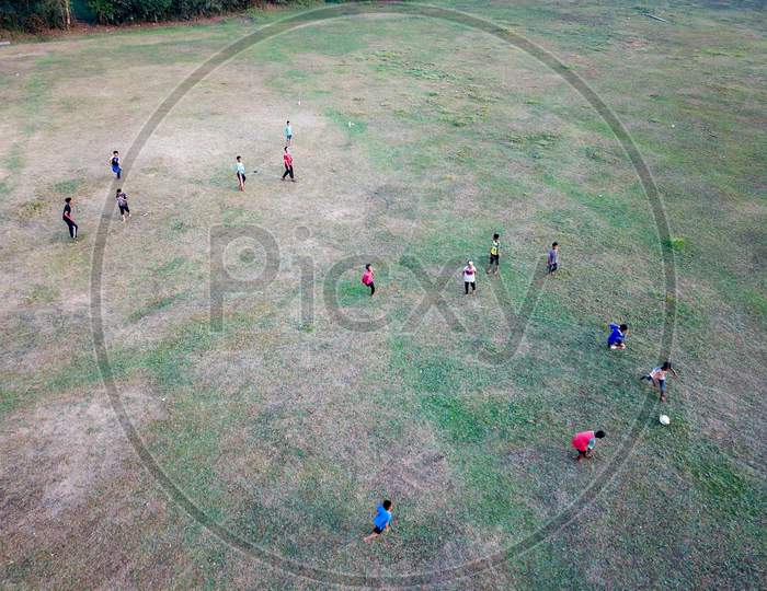Malays Kids Have Fun Cycle, Play Football In Green Field