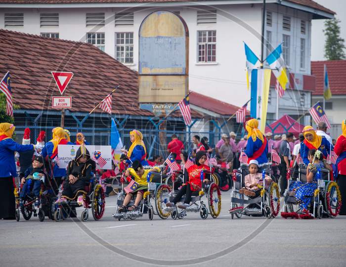 Kids In Wheel Chair Join Merdeka Parade At Street