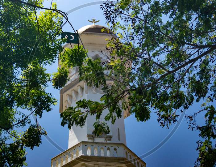 Minaret At Masjid Kapitan Keling With Green Leaves