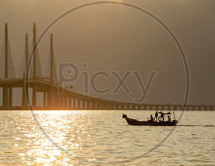 A Fishing Boat Move Toward Penang Second Bridge Main Span