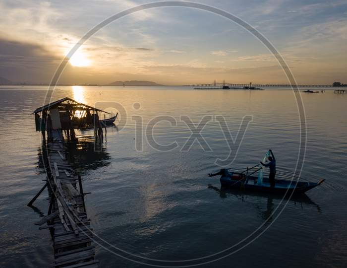 Fisherman Cast Net In Morning