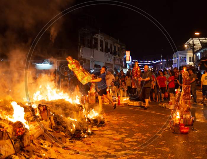 Chinese Devotees Burn Offering During Hungry Ghost Festival