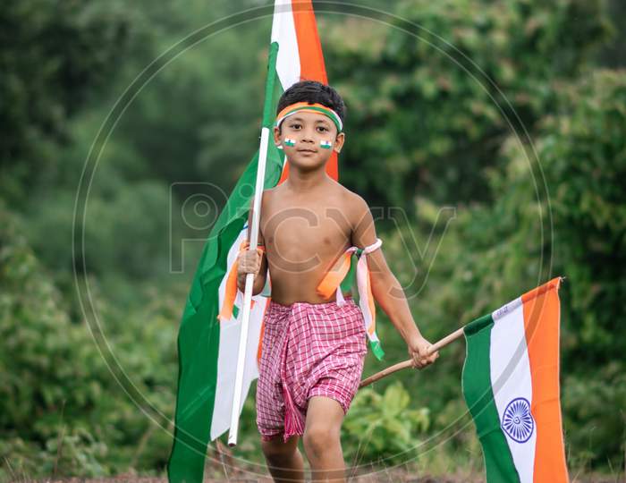 Indian child holding flag.