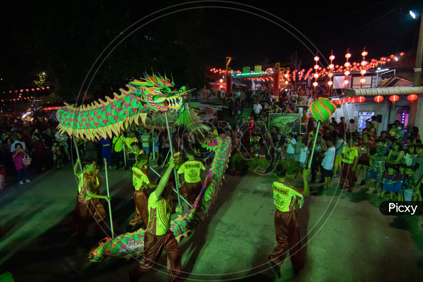 Dragon Dance Perform In Front Of Snake Temple During Chinese New Year