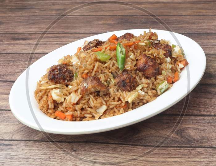 Veg Manchurian Fried Rice, Made Of Fried Mixed Vegetables Balls Along With Rice Is Tossed In Soy Tomato Based Sauce, Indo Chinese Recipe, Selective Focus