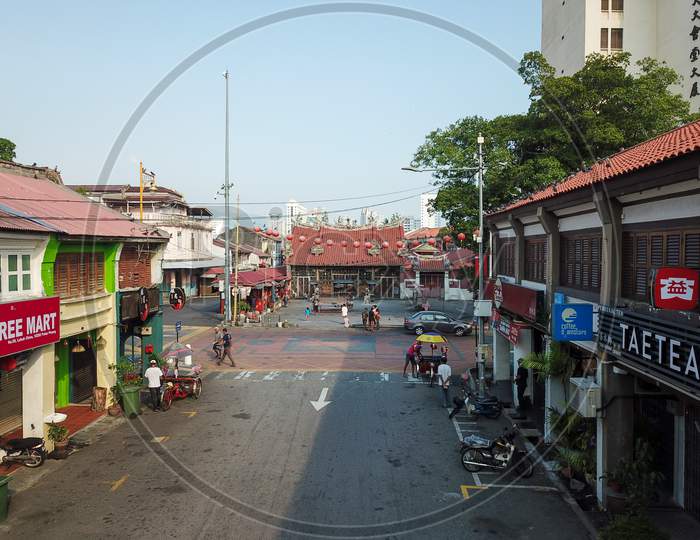 Street Lebuh China In Morning. Background Is Goddess Of Mercy Temple