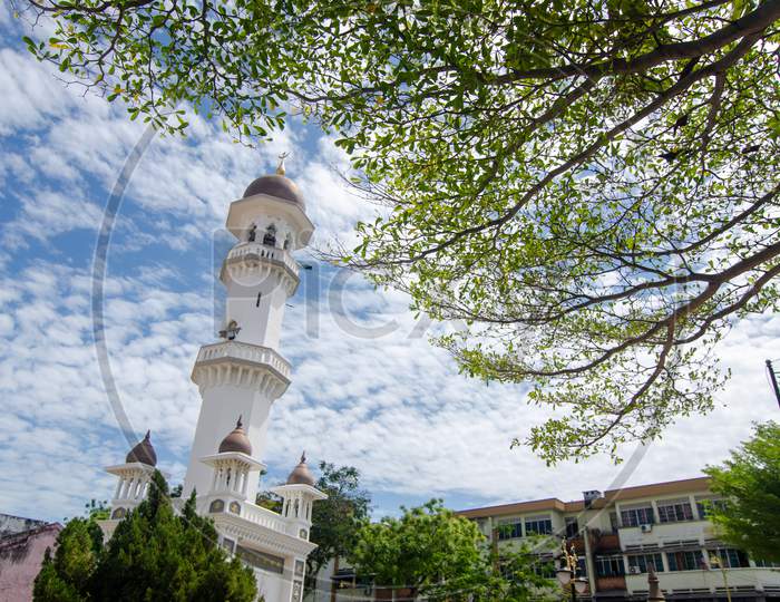 Minaret Kapitan Keling Mosque With Green Leaves
