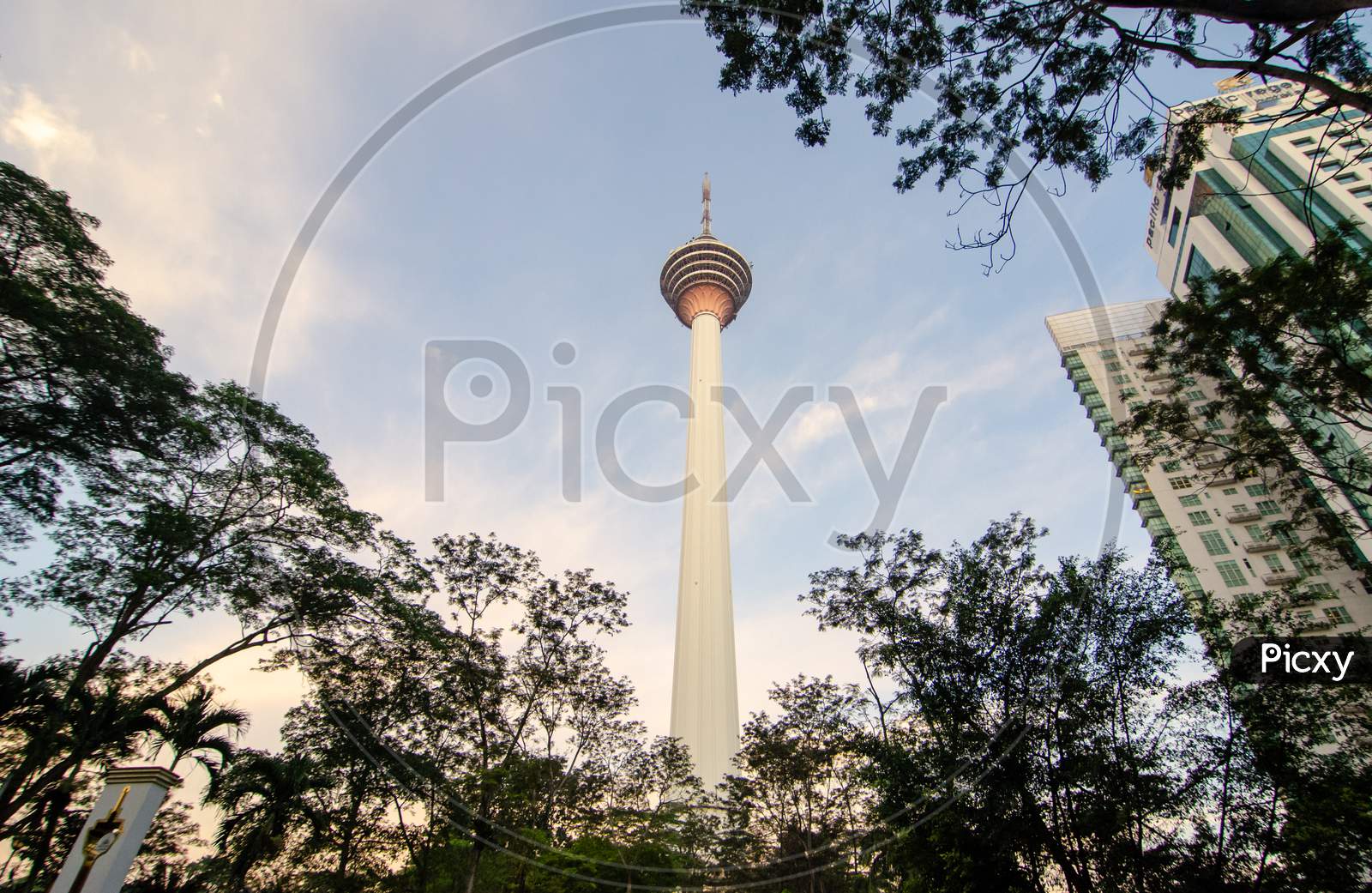 View Of Skyline Kuala Lumpur Over The Green Tree In Morning
