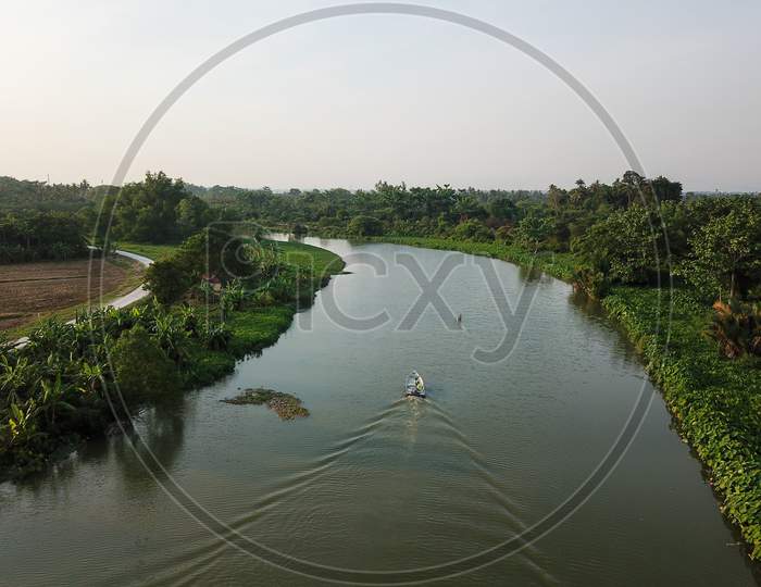 Aerial View Boats Move At Sungai Perai Near Rural Area