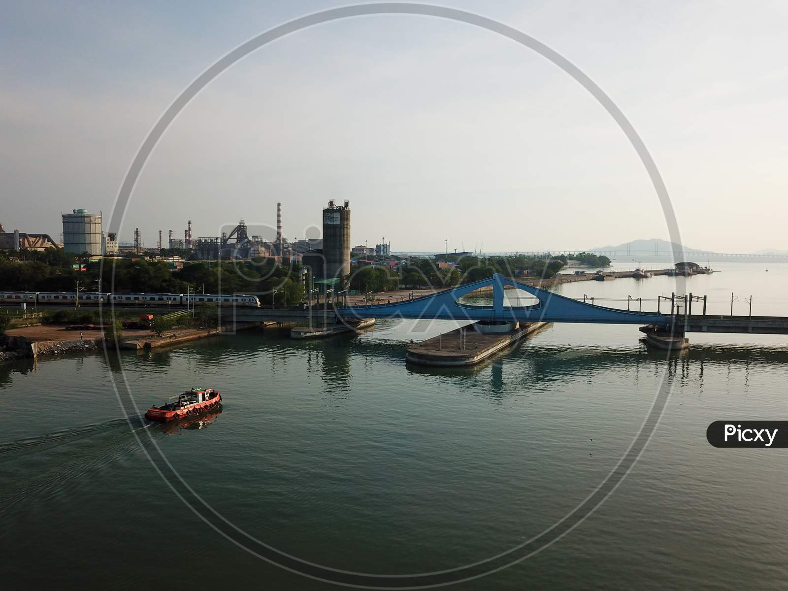 A Tugboat Is Move Toward Prai River Swing Bridge