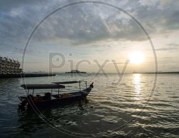 Silhouette Fisherman Cast Net At Penang Sea