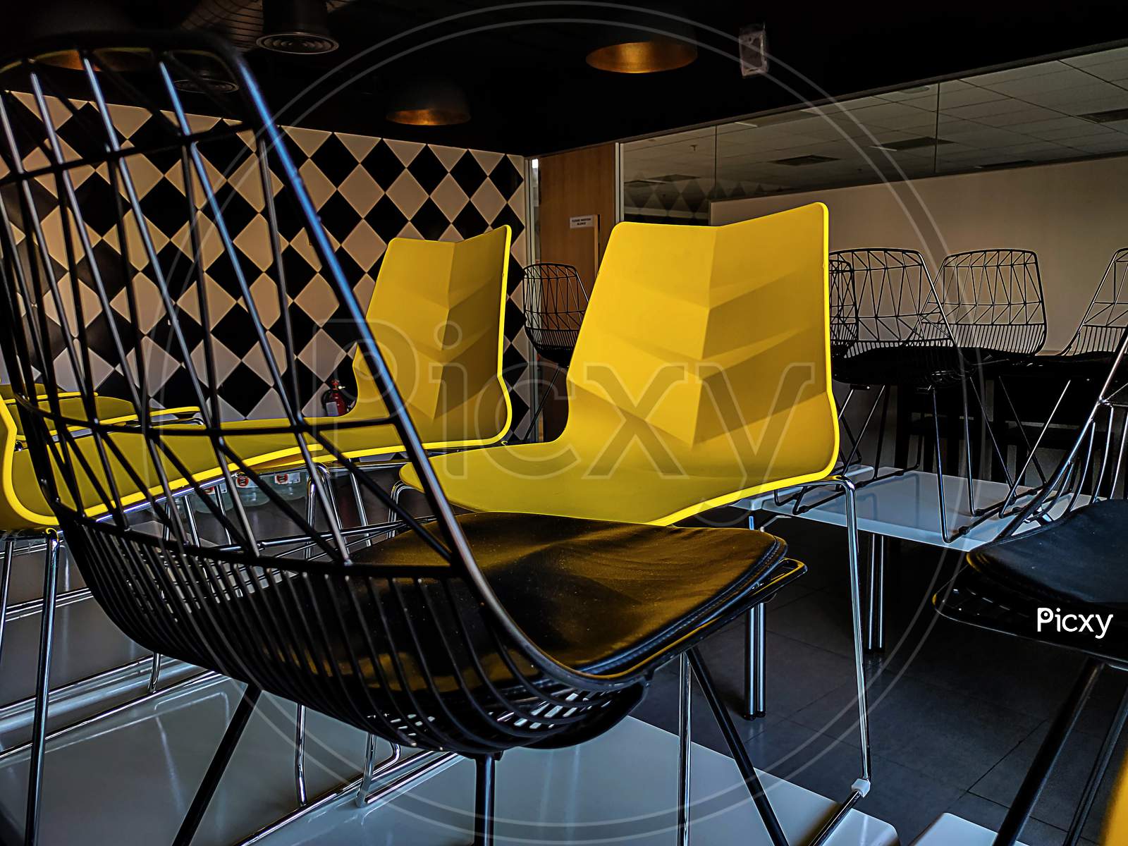 Picture Of Yellow And Black Colors Chairs Use In Meetings In It Company Bangalore India.