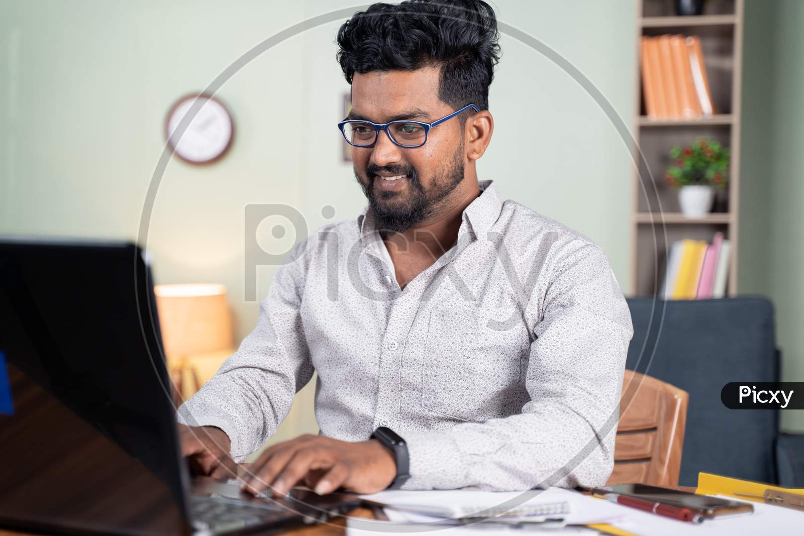 Happy Young Man Busy Working On Laptop At Home - Concept Of Professional It Employee During Work From Home.