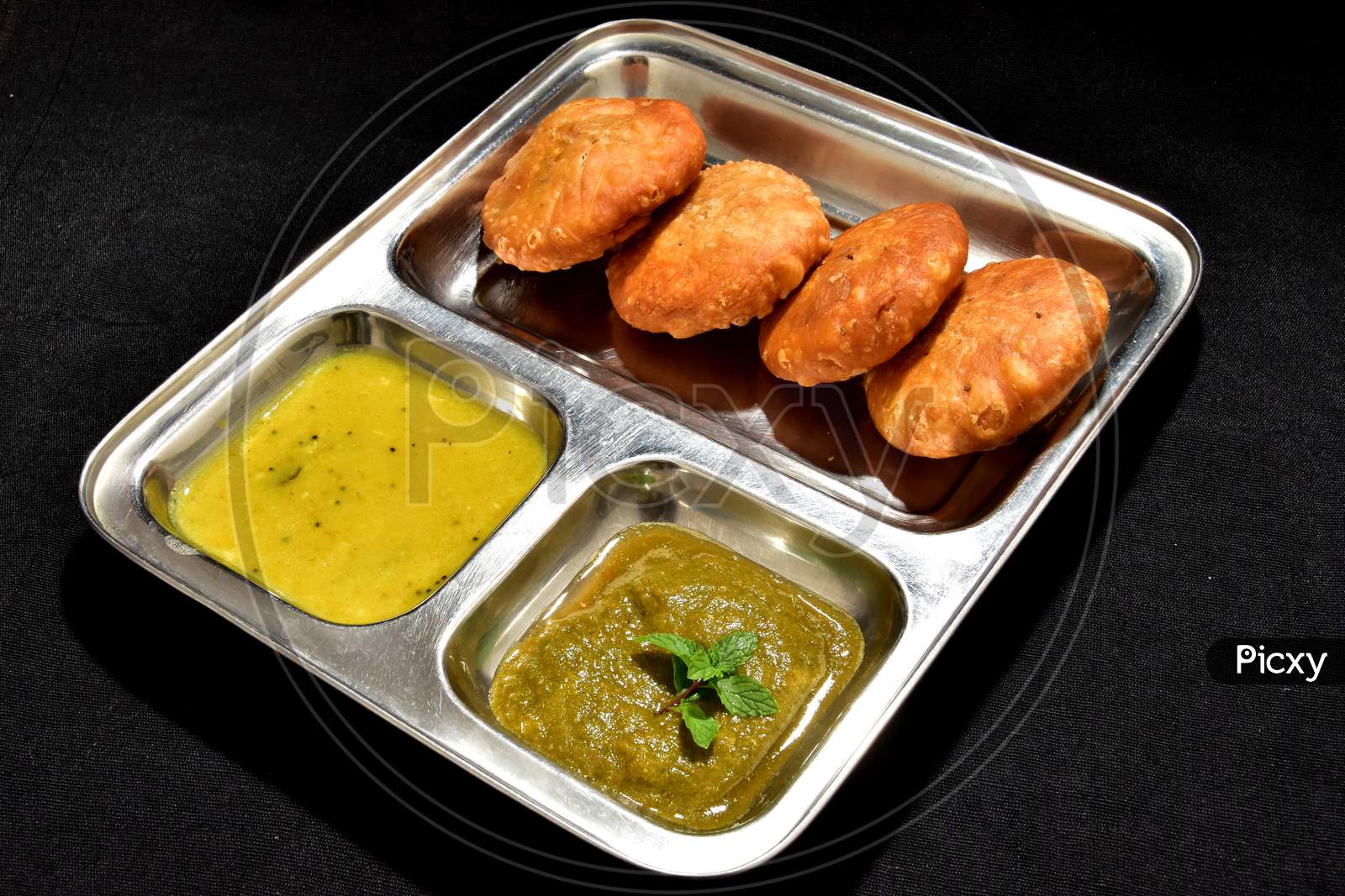Indian special traditional fried food Kachori with dal and chutney
