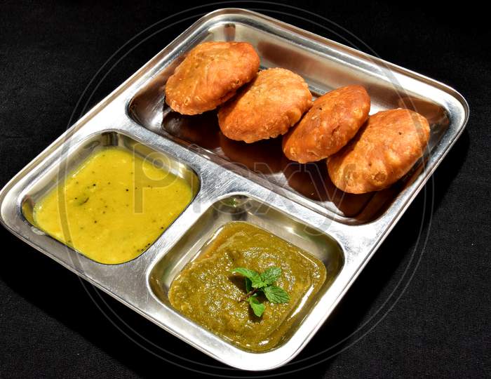 Indian special traditional fried food Kachori with dal and chutney