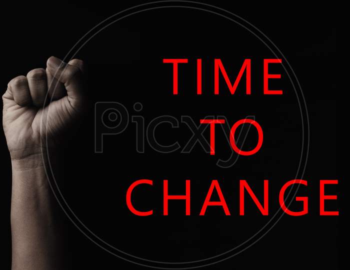 Concept Against Racism Or Racial Discrimination By Showing With Hand Gestures Fist With Time To Change Typography