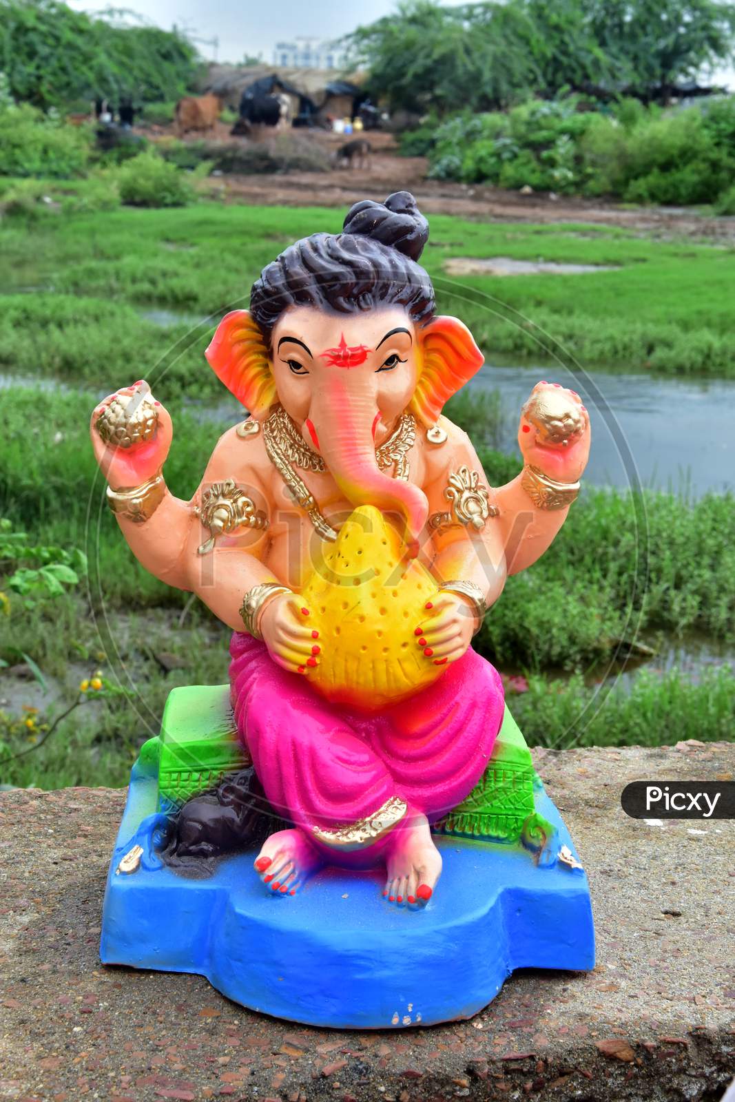 Lord Ganesha sculpture on green background. Ganesh festival of india
