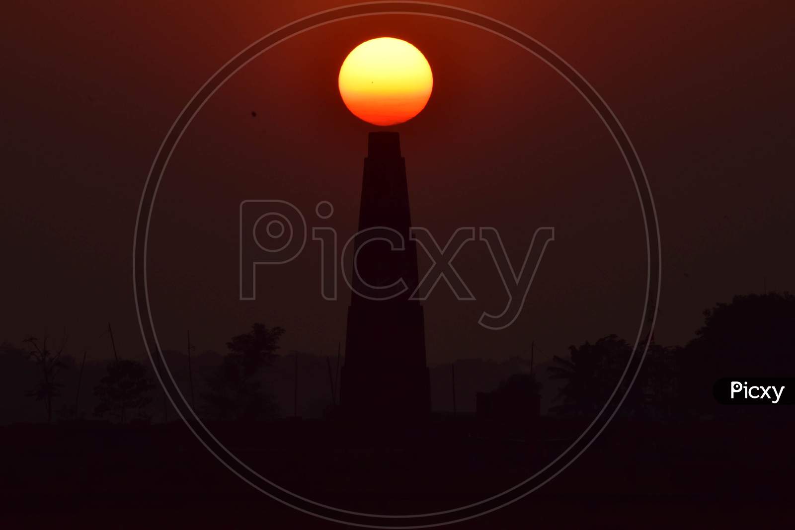 The sun set behind the brick kiln factory  in Assam on Dec 31,2020