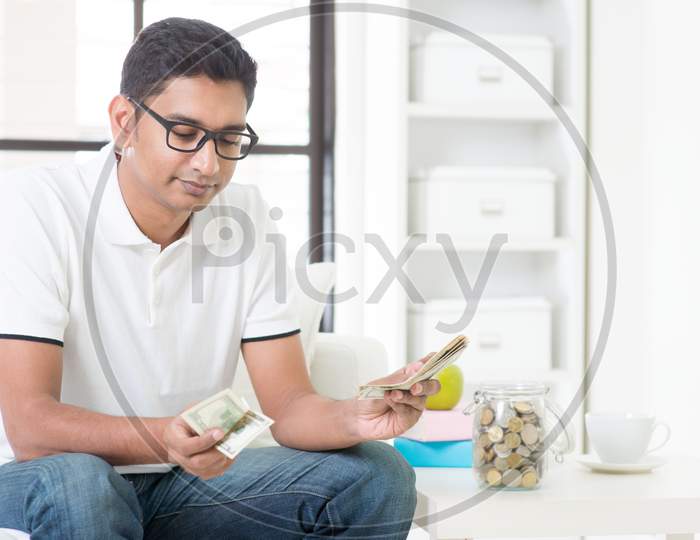 Sad Indian Guy Counting Money