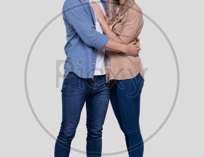Couple Standing Hugging Looking Front Wearing Medical Mask Isolated. Man And Woman Hugging, Lovers, Friends, Couple Concept
