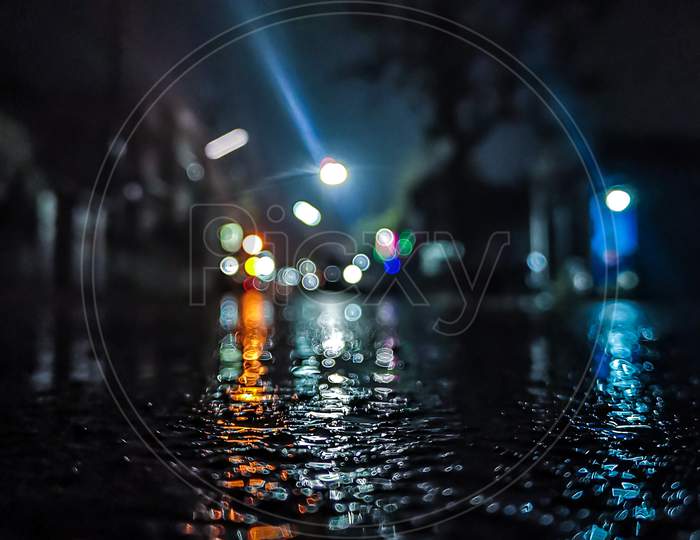 Street after rain with bright lights