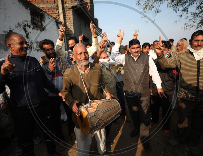 West pakstani refugee celebrate after casting vote during the Third phase of District Development Council (DDC) election at Jaffar chak in Marh near International border in Jammu,4 Dec,2020.