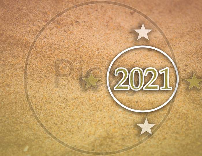 Happy New Year 2021 Concept Use With Stars And 2021 Against A Beach Sand Background.