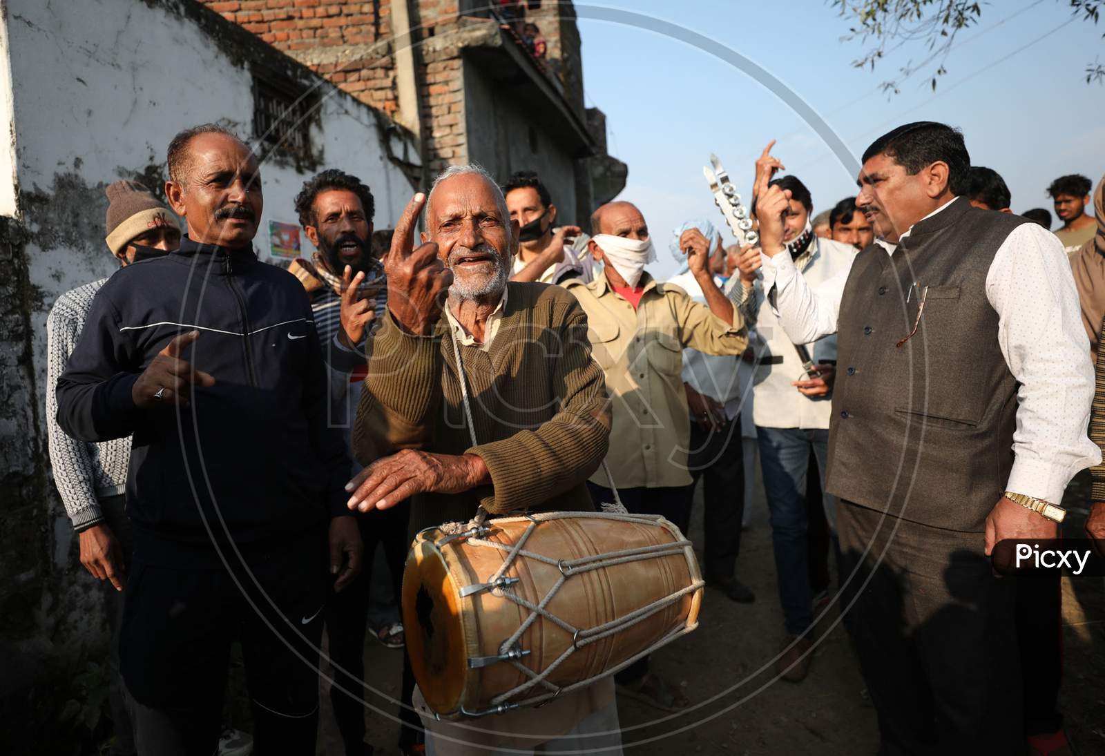 West pakstani refugee celebrate after casting vote during the Third phase of District Development Council (DDC) election at Jaffar chak in Marh near International border in Jammu,4 Dec,2020.