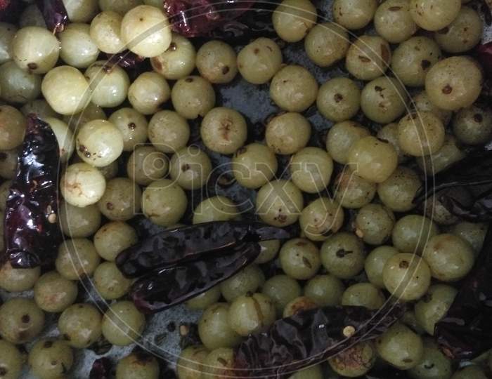 Indian gooseberries with red chillies and natural foods