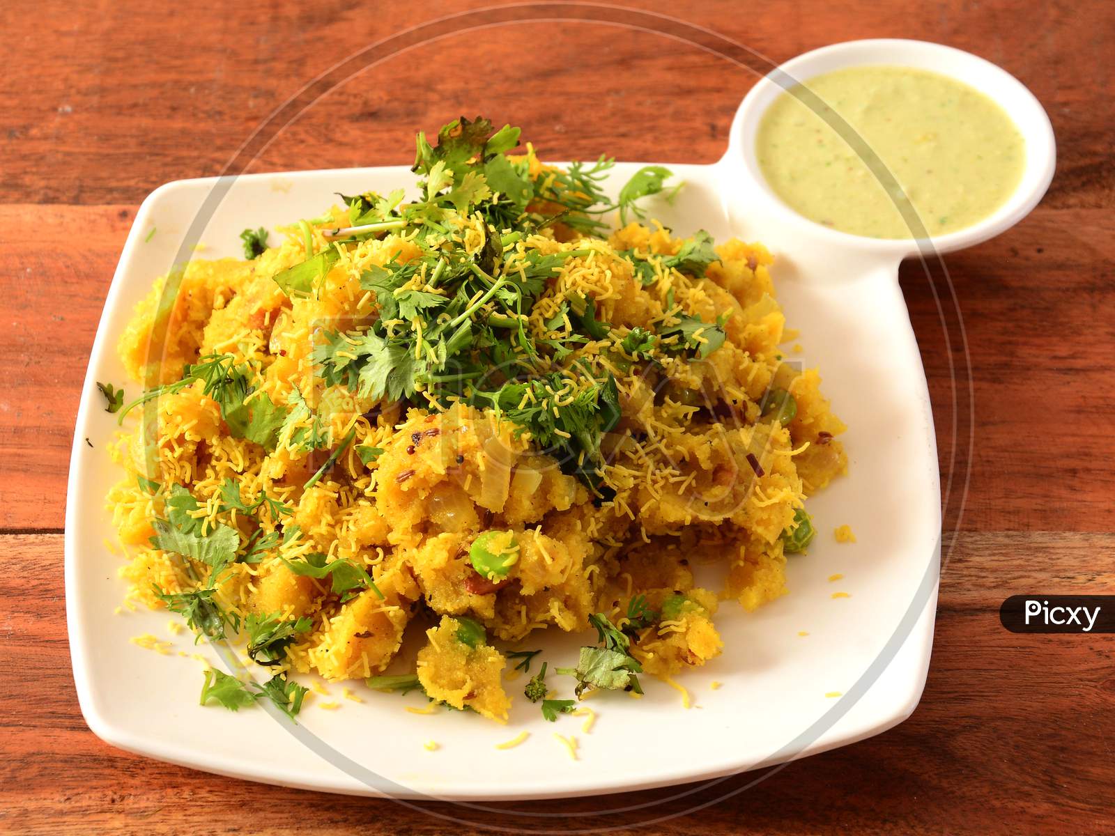 Upma With Coconut Chutney. Upma Made Of Semolina, A South Indian Breakfast Also Popular In Maharashtra,India Served Over Rustic Wooden Background, Selective Focus