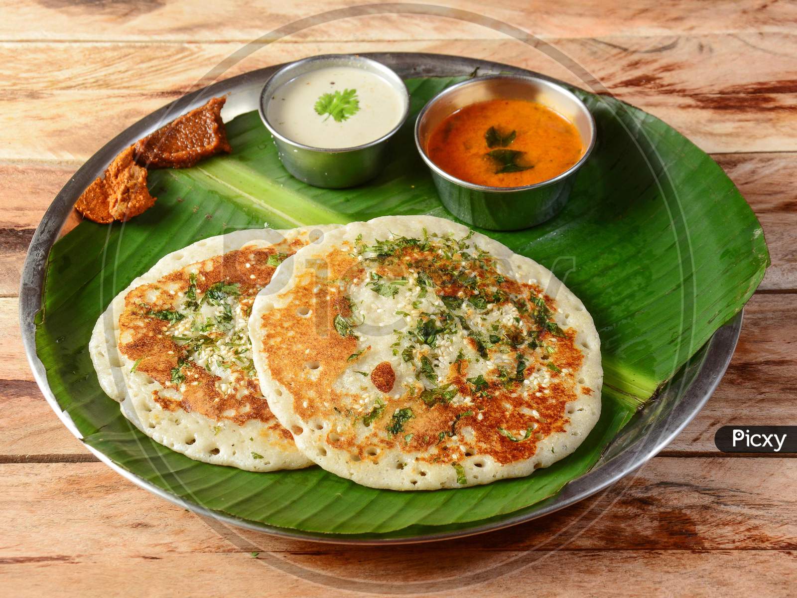 Set Dosa, A South Indian Traditional And Popular Breakfast Served With Chutney And Sambar Over A Rustic Wooden Background, Selective Focus