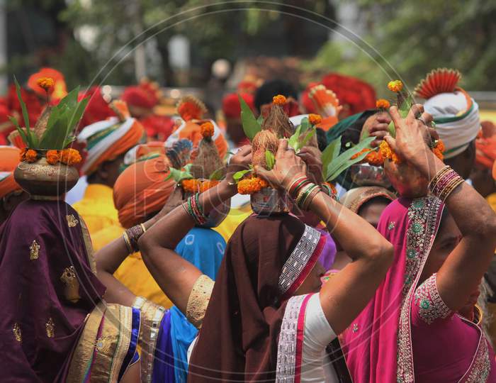 People dressed in traditional costumes take part in the procession to celebrate the Gudi Padwa festival, the beginning of the New Year for Maharashtrians, in Mumbai, India, March 2018.