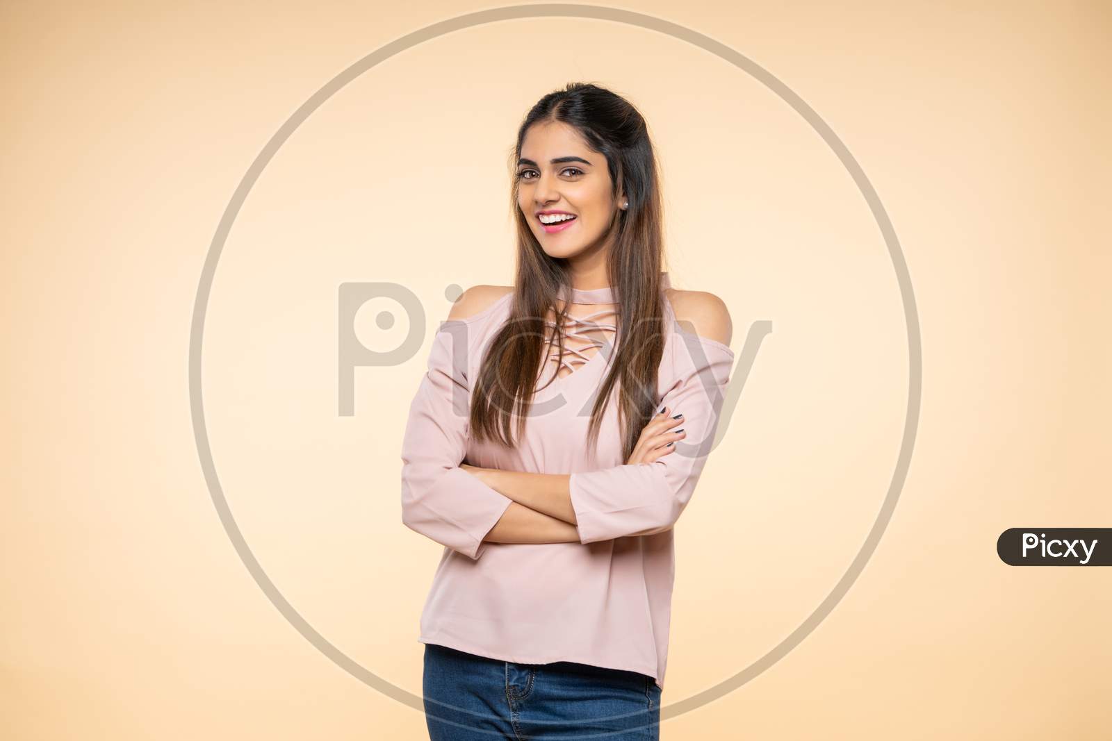 Indian young woman smiling with hand gestures