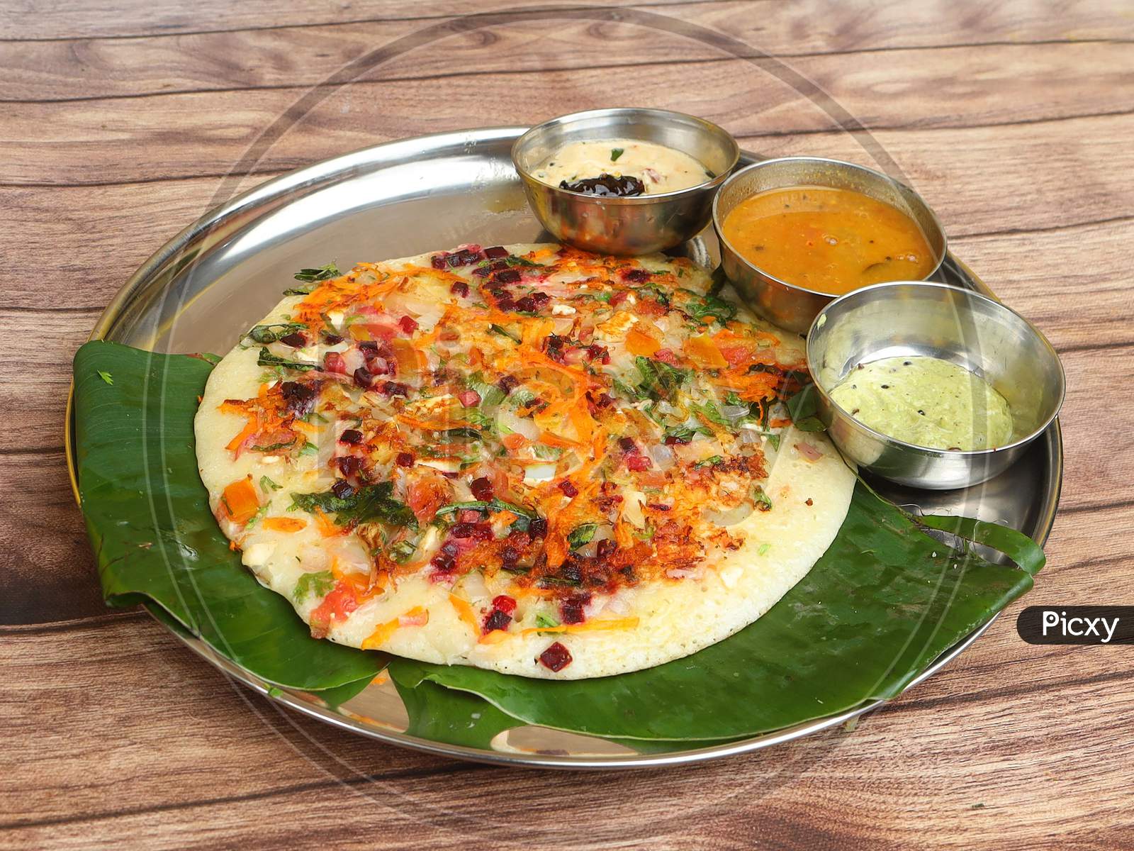 Famous South Indian Food Uttapam Or Ooththappam Is A Dosa Like Dish Made By Dosa Batter, Served With Coconut Chutney And Sambar, Selective Focus