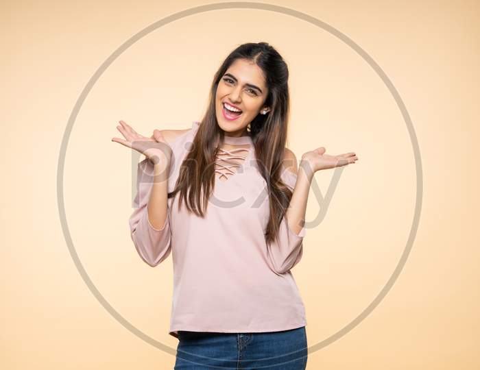 Indian young woman smiling with hand gestures