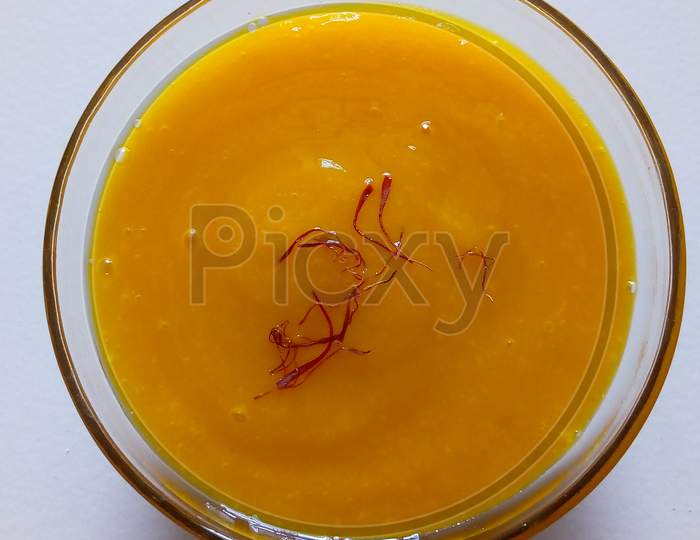 bowl of aamras and keshar/safron in bowl
