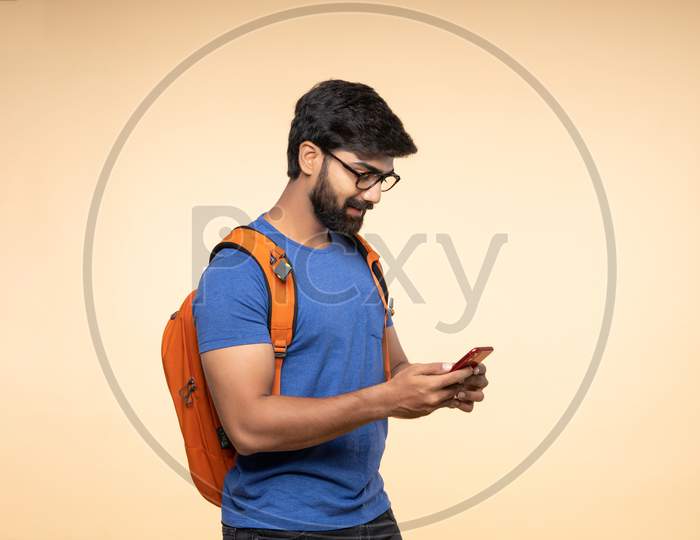 indian young tourist using smart phone