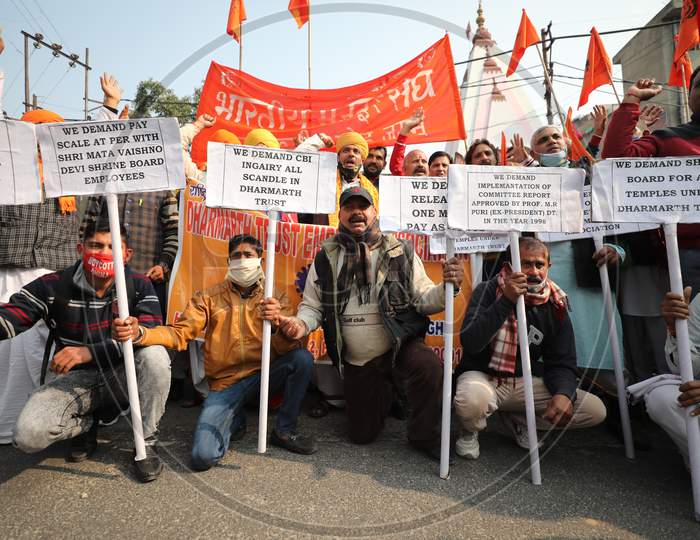 Members of Dharmarth trust, which is managing the affairs of various temples, holding a demonstration outside Raj Bhavan in Jammu in support of their various demands including its merger with Shri Mata Vaishno Devi Shrine Board and enhancement of salaries. 5,Dec,2020.