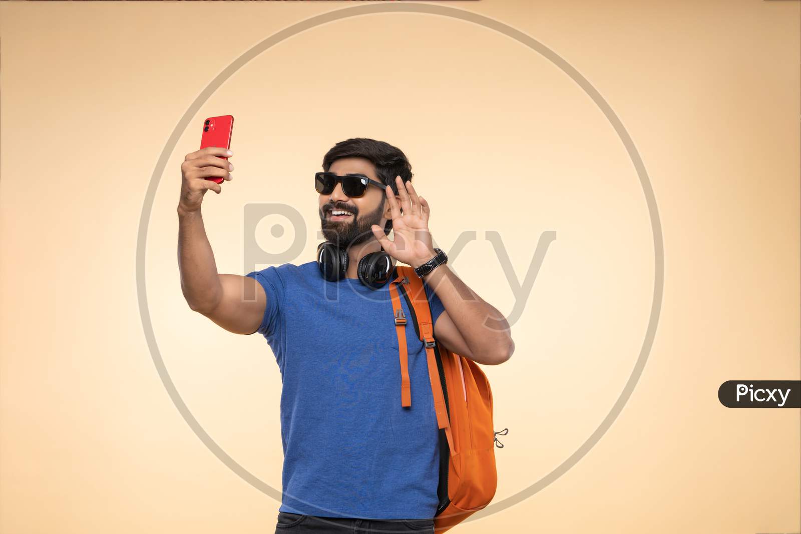 Indian young student on a video call with a smartphone