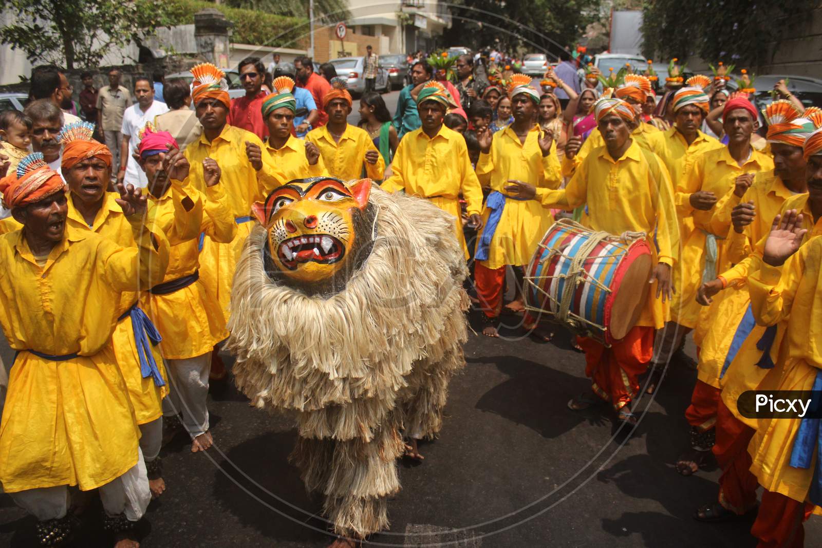 People dressed in traditional costumes take part in the procession to celebrate the Gudi Padwa festival, the beginning of the New Year for Maharashtrians, in Mumbai, India, March 2018.