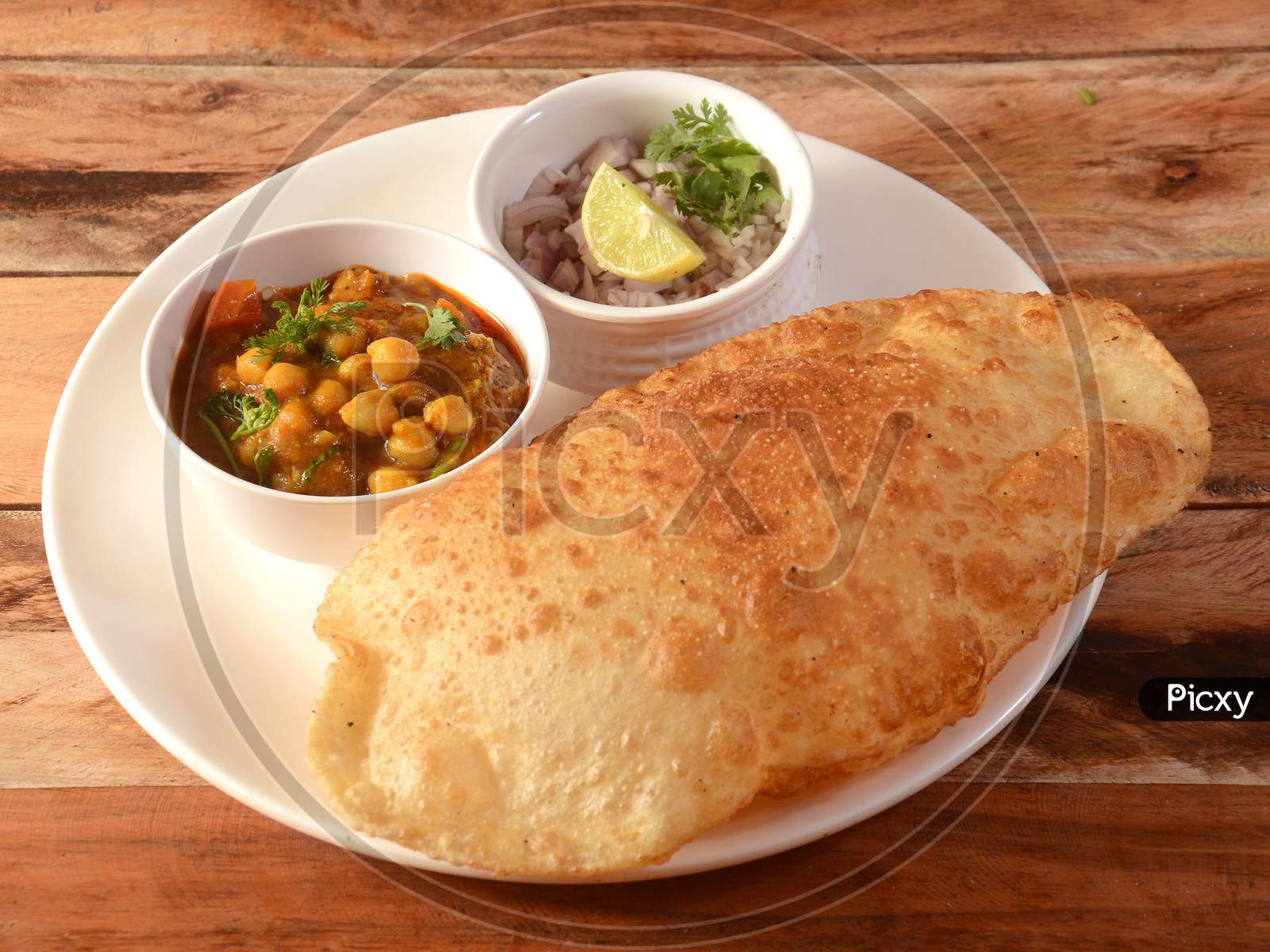 Chole Bhature, Spicy Chick Peas Curry Also Known As Chole Or Channa Masala Is Traditional North Indian Main Course Recipe And Usually Served With Fried Puri Or Bhature, Selective Focus