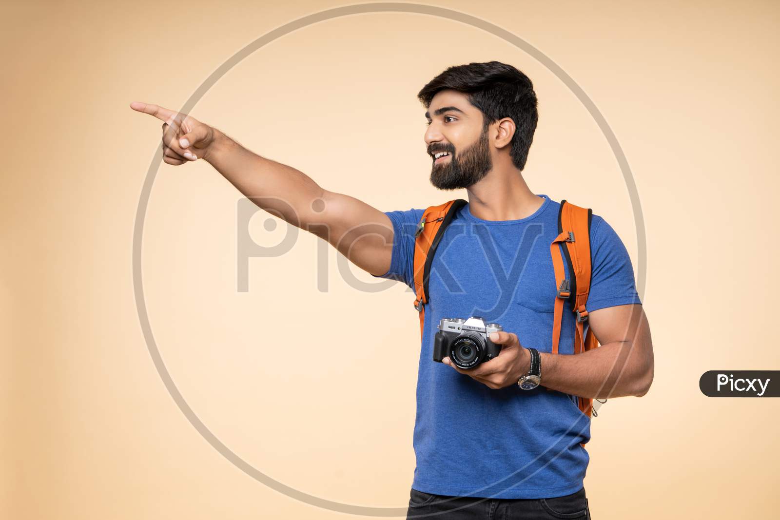Indian young male tourist with a gesturing camera