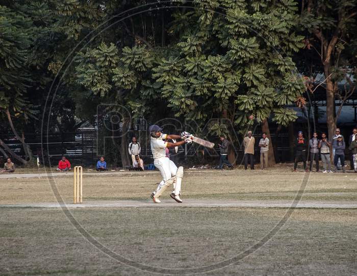 The Cricket batsman in action.