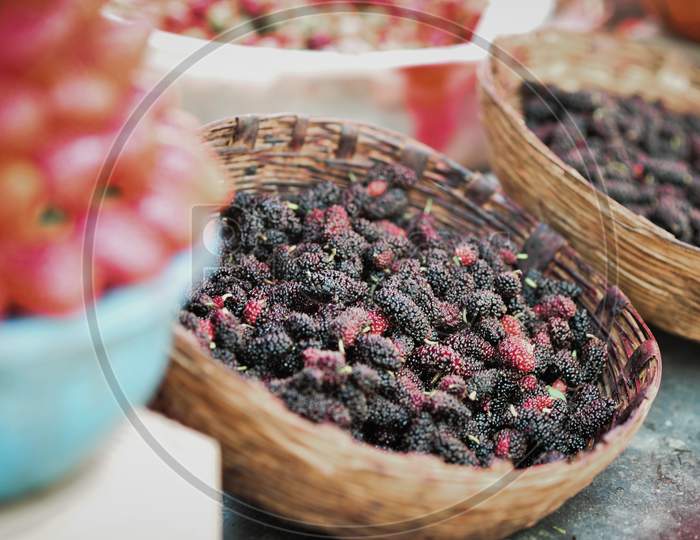 mulberry and raspberry in a bamboo container for sale